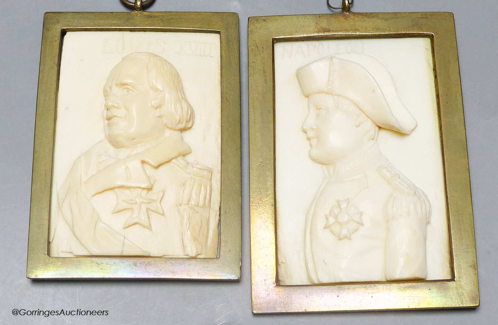 A pair of 19th century carved ivory portrait reliefs, Napoleon and Louis XVIII, 6 x 8.5cm